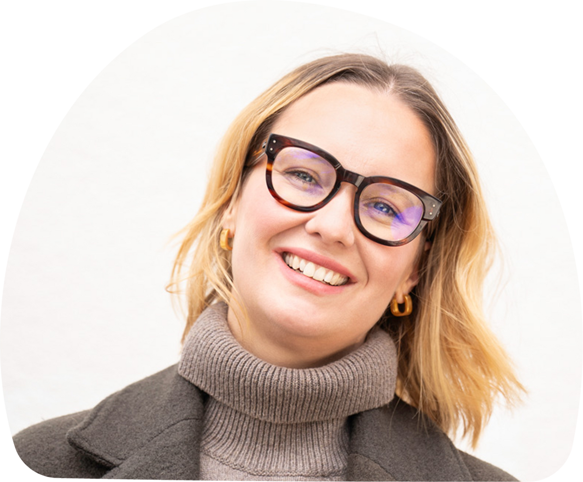 Close-up portrait of Lenka Kohnz, MOMent advisor, against a white background