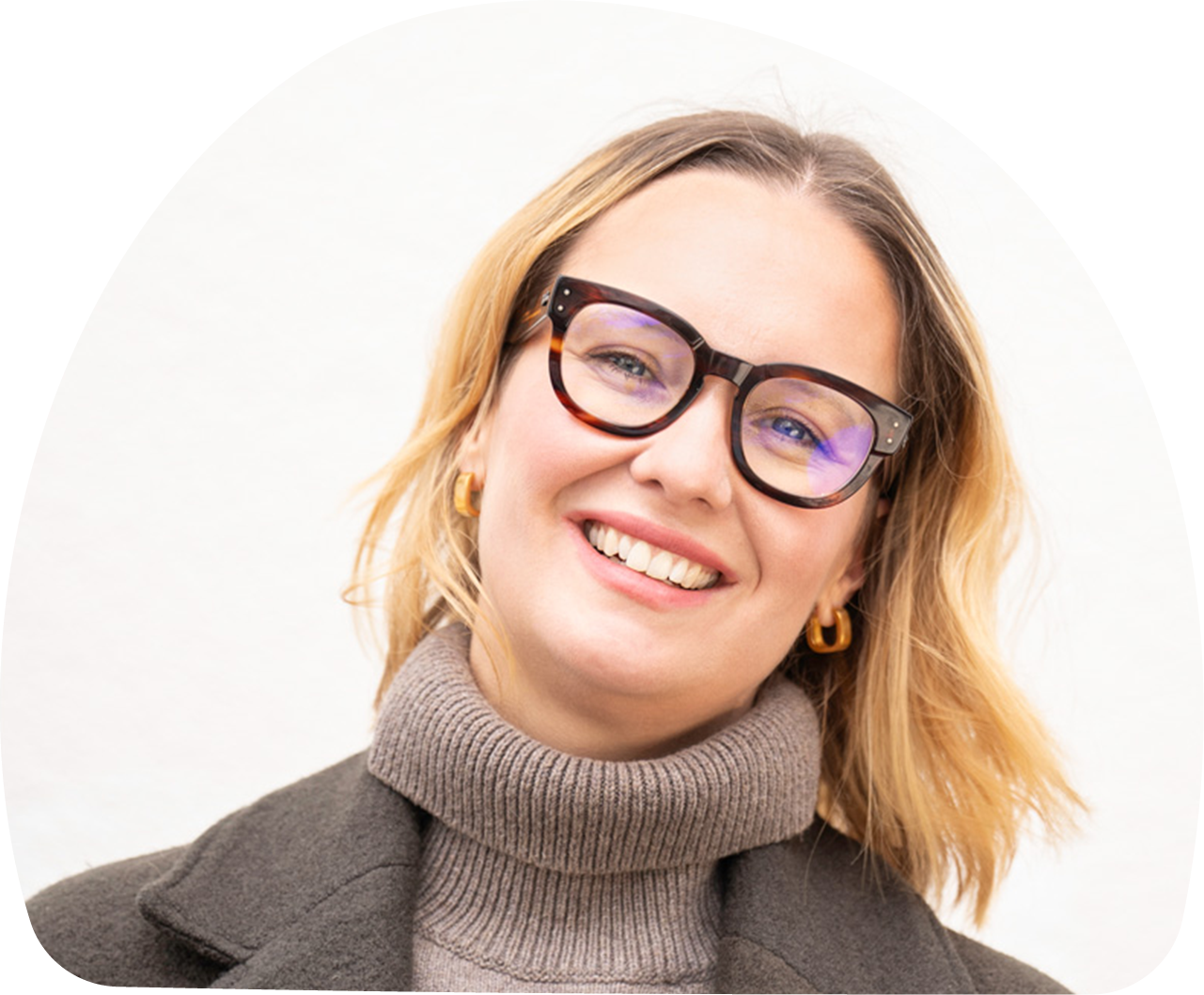 Close-up portrait of Lenka Kohnz, MOMent advisor, against a white background