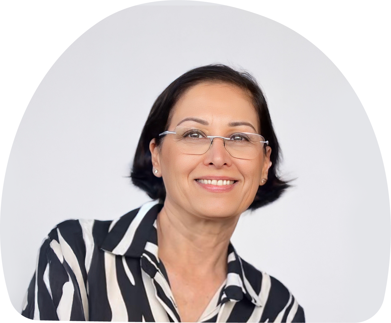 Close-up portrait of Dr. Riki Langberg, MOMent formulation consultant, with a white-grey background